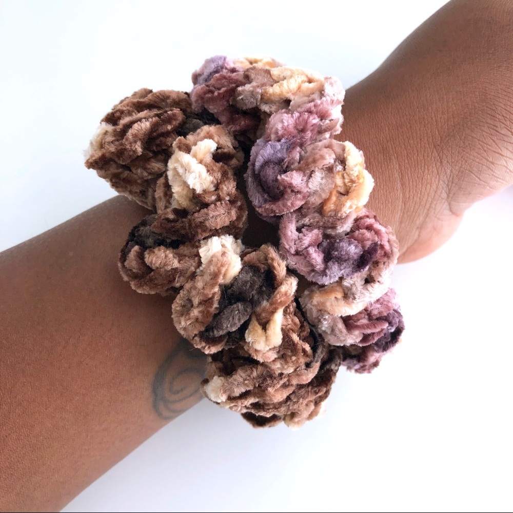 Two multi color velvet scrunchies.